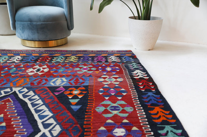 Vintage kilim rug in living room setting, bright colors, wild shaman, soft rug, bold color, Portland, Oregon, rug store, rug shop, local shop, vintage rug, modern kilim, warm colors, antique kilim rug