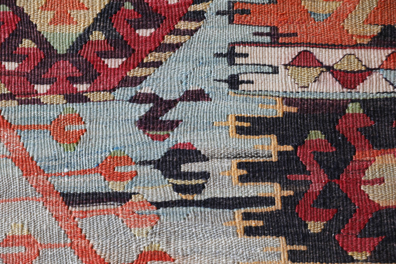  Vintage kilim rug in living room setting, old rug, antique rug, pastel colors, faded colors, Turkish rug, vintage rug, soft rug, Portland, Oregon, rug store, rug shop, local shop, earthy tones, earthy colors, warm colors