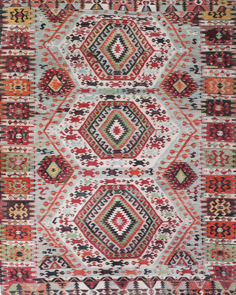  Vintage kilim rug in living room setting, old rug, antique rug, pastel colors, faded colors, Turkish rug, vintage rug, soft rug, Portland, Oregon, rug store, rug shop, local shop, earthy tones, earthy colors, warm colors