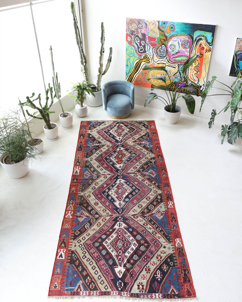  Vintage kilim rug in living room setting, old rug, antique rug, pastel colors, faded colors, Turkish rug, vintage rug, soft rug, Portland, Oregon, rug store, rug shop, local shop, earthy tones, earthy colors, warm colors