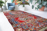 Vintage kilim rug in living room setting, bright colors, wild shaman, soft rug, bold color, Portland, Oregon, rug store, rug shop, local shop, vintage rug, modern kilim, warm colors, antique rug, antique kilim