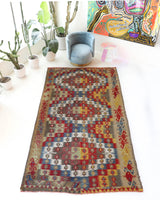 Vintage kilim rug in living room setting, bright colors, wild shaman, soft rug, bold color, Portland, Oregon, rug store, rug shop, local shop, vintage rug, modern kilim, warm colors, antique kilim rug