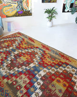 Vintage kilim rug in living room setting, bright colors, wild shaman, soft rug, bold color, Portland, Oregon, rug store, rug shop, local shop, vintage rug, modern kilim, warm colors, antique kilim rug