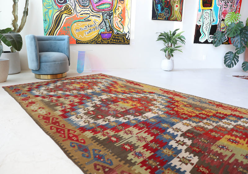 Vintage kilim rug in living room setting, bright colors, wild shaman, soft rug, bold color, Portland, Oregon, rug store, rug shop, local shop, vintage rug, modern kilim, warm colors, antique kilim rug