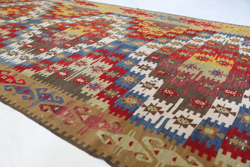 Vintage kilim rug in living room setting, bright colors, wild shaman, soft rug, bold color, Portland, Oregon, rug store, rug shop, local shop, vintage rug, modern kilim, warm colors, antique kilim rug