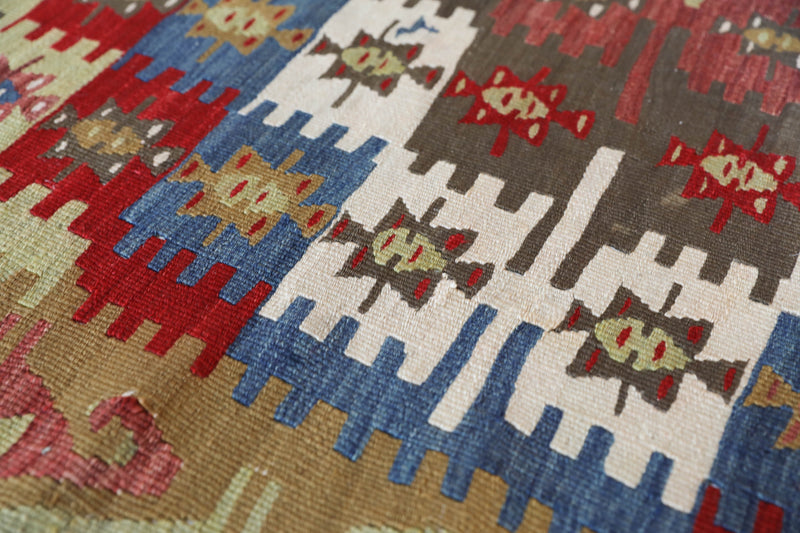 Vintage kilim rug in living room setting, bright colors, wild shaman, soft rug, bold color, Portland, Oregon, rug store, rug shop, local shop, vintage rug, modern kilim, warm colors, antique kilim rug