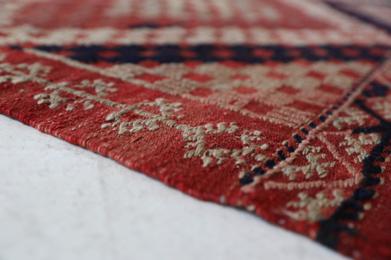 Vintage kilim rug in living room setting, old rug, antique rug, pastel colors, faded colors, Turkish rug, vintage rug, soft rug, Portland, Oregon, rug store, rug shop, local shop, earthy tones, earthy colors, warm colors