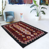 Vintage kilim rug in living room setting, bright colors, wild shaman, soft rug, bold color, Portland, Oregon, rug store, rug shop, local shop, vintage rug, modern kilim, warm colors, antique rug, antique kilim