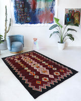 Vintage kilim rug in living room setting, bright colors, wild shaman, soft rug, bold color, Portland, Oregon, rug store, rug shop, local shop, vintage rug, modern kilim, warm colors, antique rug, antique kilim