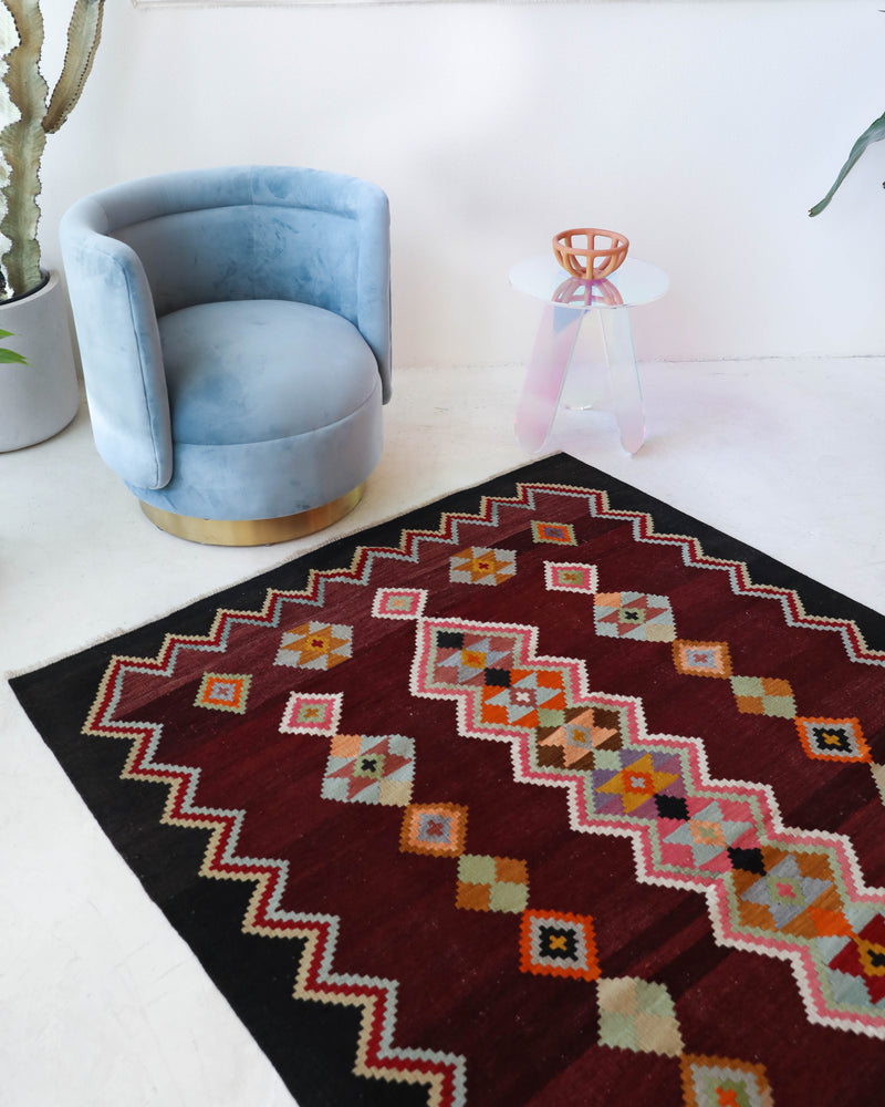 Vintage kilim rug in living room setting, bright colors, wild shaman, soft rug, bold color, Portland, Oregon, rug store, rug shop, local shop, vintage rug, modern kilim, warm colors, antique rug, antique kilim