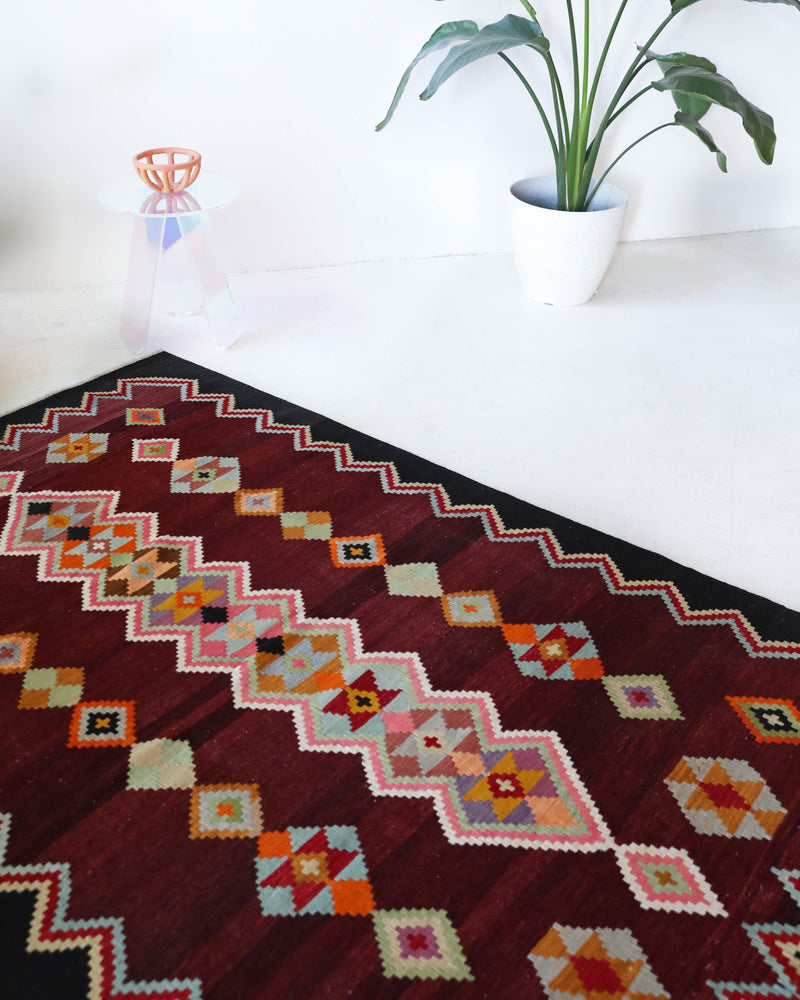 Vintage kilim rug in living room setting, bright colors, wild shaman, soft rug, bold color, Portland, Oregon, rug store, rug shop, local shop, vintage rug, modern kilim, warm colors, antique rug, antique kilim