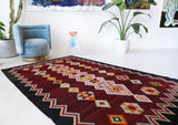 Vintage kilim rug in living room setting, bright colors, wild shaman, soft rug, bold color, Portland, Oregon, rug store, rug shop, local shop, vintage rug, modern kilim, warm colors, antique rug, antique kilim