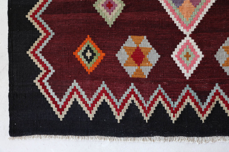 Vintage kilim rug in living room setting, bright colors, wild shaman, soft rug, bold color, Portland, Oregon, rug store, rug shop, local shop, vintage rug, modern kilim, warm colors, antique rug, antique kilim