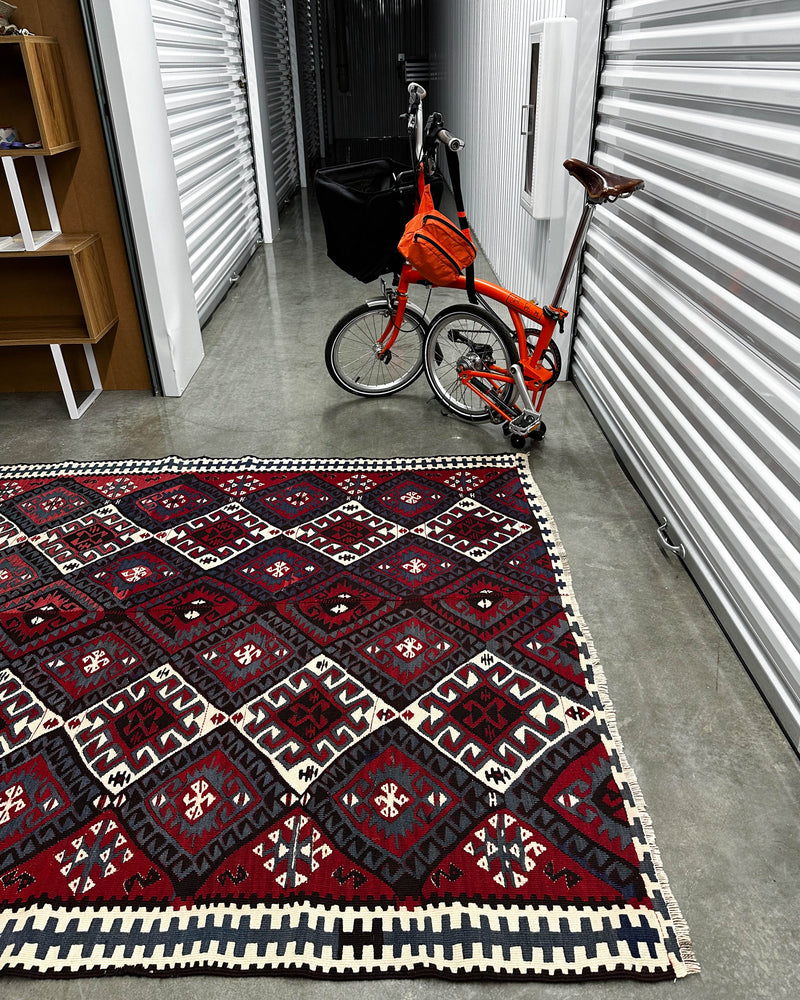 Vintage kilim rug in living room setting, bright colors, wild shaman, soft rug, bold color, Portland, Oregon, rug store, rug shop, local shop, vintage rug, modern kilim, warm colors, antique rug, antique kilim