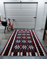 Vintage kilim rug in living room setting, bright colors, wild shaman, soft rug, bold color, Portland, Oregon, rug store, rug shop, local shop, vintage rug, modern kilim, warm colors, antique rug, antique kilim