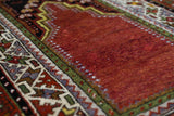 Turkish rug in a living room setting, pile rug, Turkish rug, vintage rug, portland, rug shop, bright colors, wild shaman, soft rug, bold color, Portland, Oregon, rug store, rug shop, local shop, antique rug