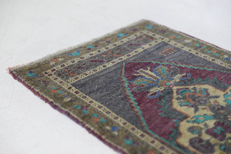 Vintage Turkish mini rug in room decor setting, old rug, antique rug, pastel colors, faded colors, Turkish rug, vintage rug, soft rug, Portland, Oregon, rug store, rug shop, local shop,  bright colors, bold colors