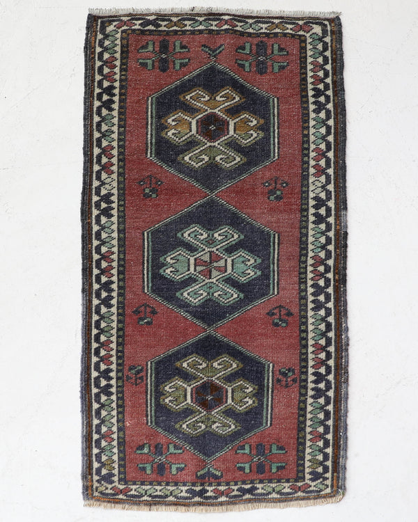 Vintage Turkish mini rug in room decor setting, old rug, antique rug, pastel colors, faded colors, Turkish rug, vintage rug, soft rug, Portland, Oregon, rug store, rug shop, local shop,  bright colors, bold colors