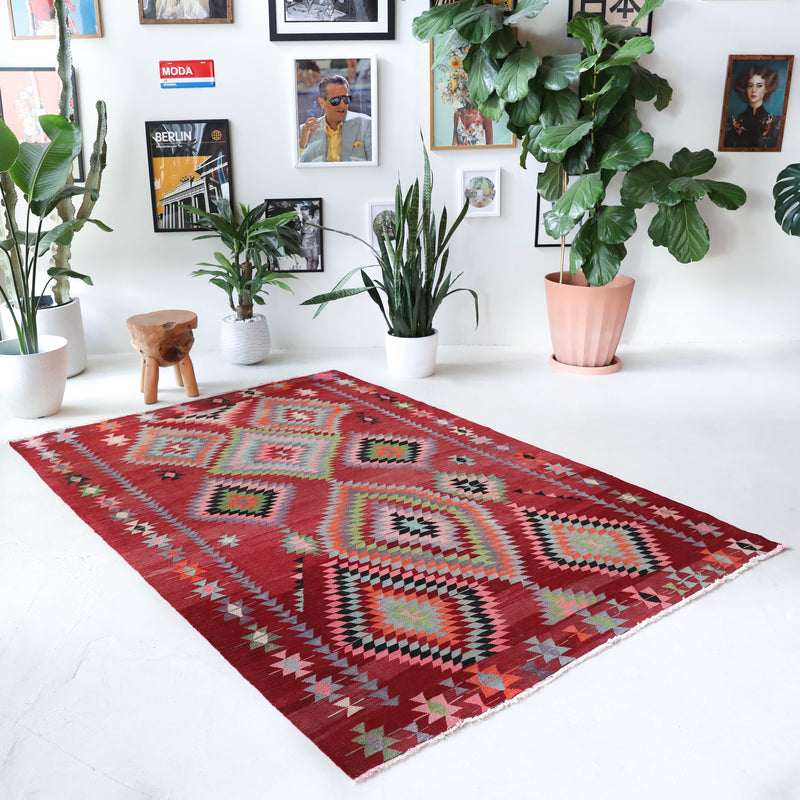  Vintage kilim rug in living room setting, old rug, antique rug, pastel colors, faded colors, Turkish rug, vintage rug, soft rug, Portland, Oregon, rug store, rug shop, local shop, earthy tones, earthy colors, warm colors