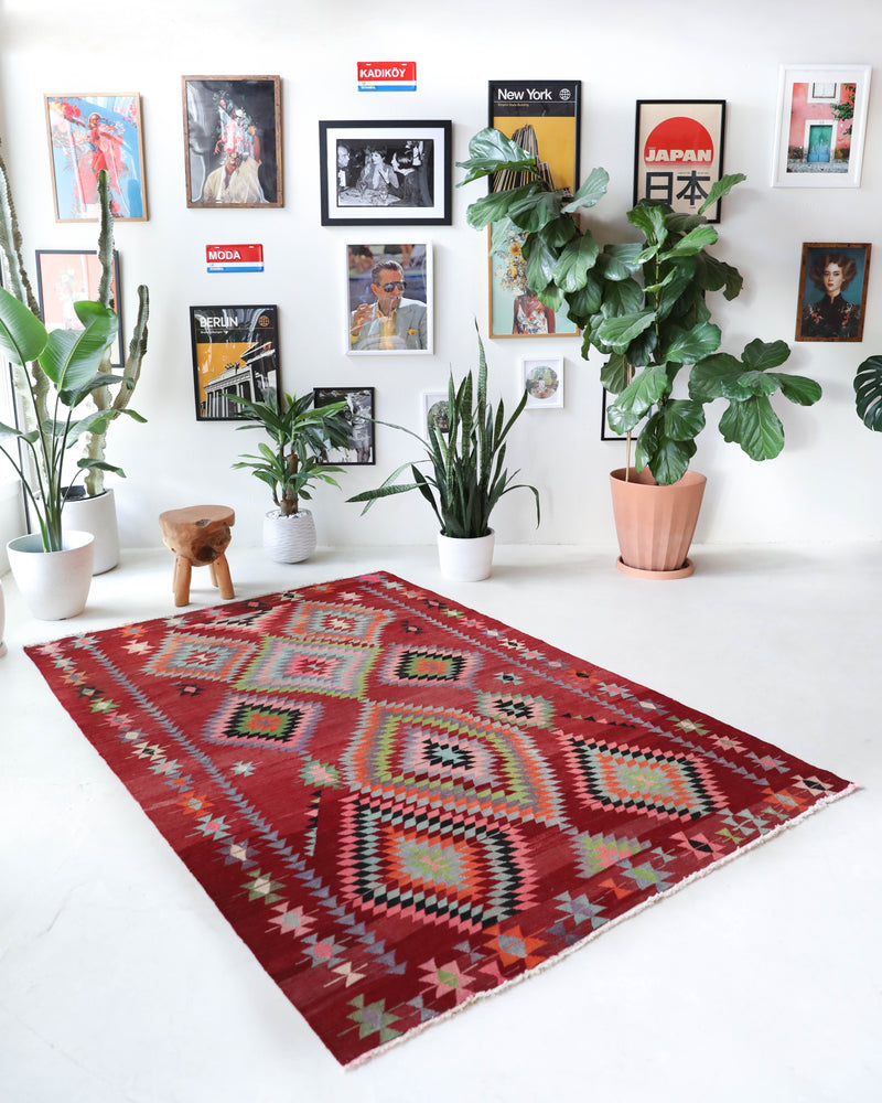  Vintage kilim rug in living room setting, old rug, antique rug, pastel colors, faded colors, Turkish rug, vintage rug, soft rug, Portland, Oregon, rug store, rug shop, local shop, earthy tones, earthy colors, warm colors