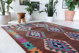 Vintage kilim rug in living room setting, old rug, antique rug, pastel colors, faded colors, Turkish rug, vintage rug, soft rug, Portland, Oregon, rug store, rug shop, local shop, earthy tones, earthy colors, warm colors