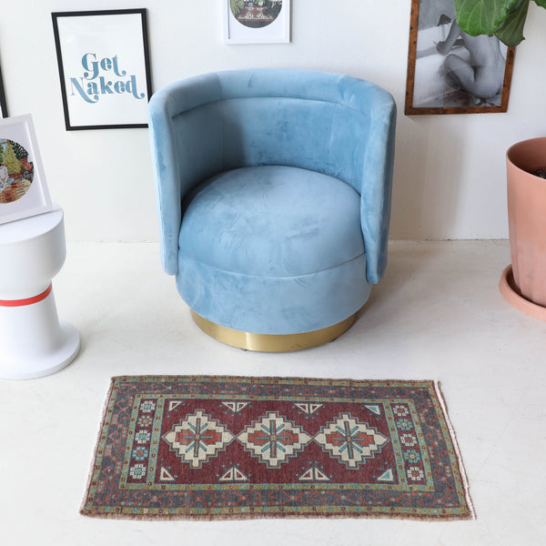 Vintage Turkish mini rug in room decor setting, old rug, antique rug, pastel colors, faded colors, Turkish rug, vintage rug, soft rug, Portland, Oregon, rug store, rug shop, local shop,  bright colors, bold colors