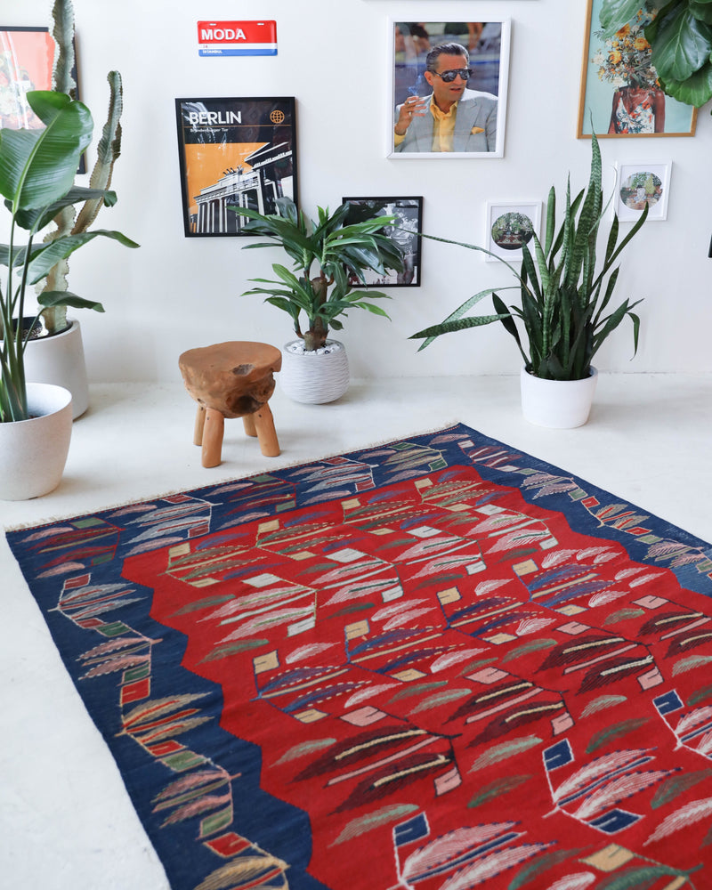 Vintage kilim rug in living room setting, old rug, antique rug, pastel colors, faded colors, Turkish rug, vintage rug, soft rug, Portland, Oregon, rug store, rug shop, local shop, earthy tones, earthy colors, warm colors