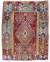 Vintage kilim rug in room decor setting, old rug, antique rug, pastel colors, faded colors, Turkish rug, vintage rug, soft rug, Portland, Oregon, rug store, rug shop, local shop, bold colors, bright colors, faded colors