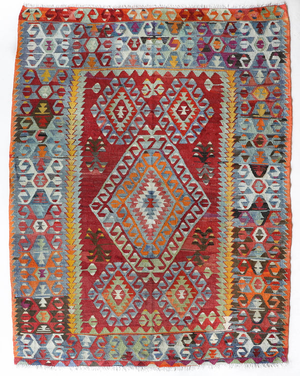 Vintage kilim rug in room decor setting, old rug, antique rug, pastel colors, faded colors, Turkish rug, vintage rug, soft rug, Portland, Oregon, rug store, rug shop, local shop, bold colors, bright colors, faded colors