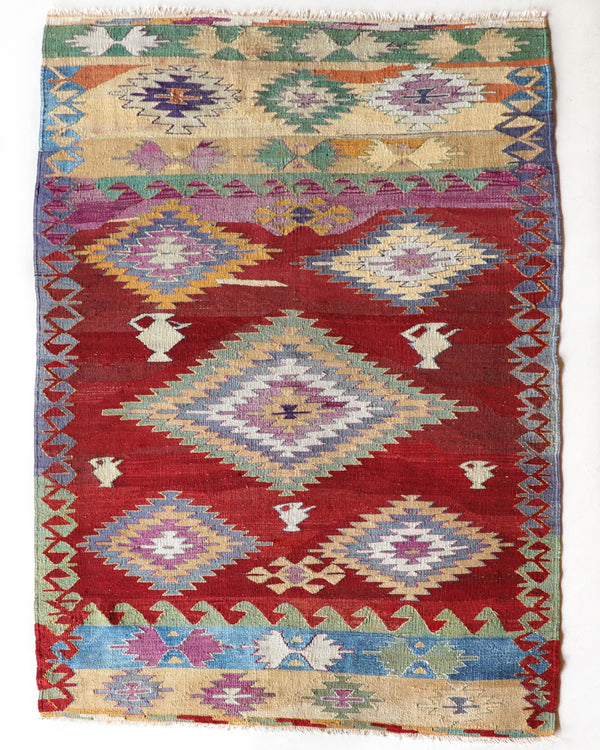 Vintage kilim rug in room decor setting, old rug, antique rug, pastel colors, faded colors, Turkish rug, vintage rug, soft rug, Portland, Oregon, rug store, rug shop, local shop, bold colors, bright colors, faded colors