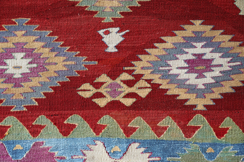 Vintage kilim rug in room decor setting, old rug, antique rug, pastel colors, faded colors, Turkish rug, vintage rug, soft rug, Portland, Oregon, rug store, rug shop, local shop, bold colors, bright colors, faded colors