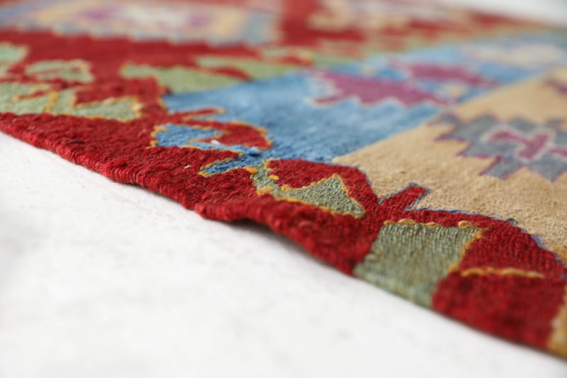 Vintage kilim rug in room decor setting, old rug, antique rug, pastel colors, faded colors, Turkish rug, vintage rug, soft rug, Portland, Oregon, rug store, rug shop, local shop, bold colors, bright colors, faded colors