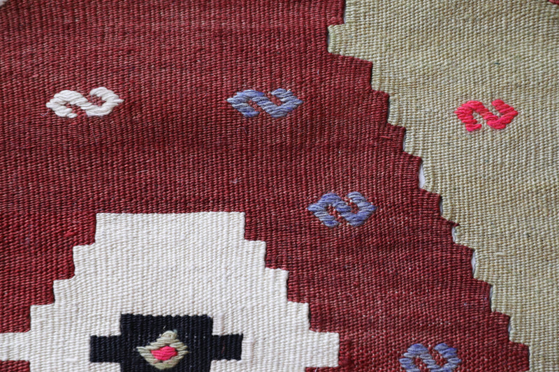 Vintage Turkish rug in a living room setting, pile rug, Turkish rug, vintage rug, portland, rug shop, bright colors, wild shaman, soft rug, bold color, Portland, Oregon, rug store, rug shop, local shop, antique rug