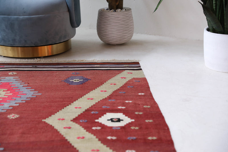 Vintage Turkish rug in a living room setting, pile rug, Turkish rug, vintage rug, portland, rug shop, bright colors, wild shaman, soft rug, bold color, Portland, Oregon, rug store, rug shop, local shop, antique rug