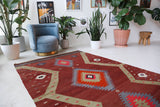 Vintage Turkish rug in a living room setting, pile rug, Turkish rug, vintage rug, portland, rug shop, bright colors, wild shaman, soft rug, bold color, Portland, Oregon, rug store, rug shop, local shop, antique rug