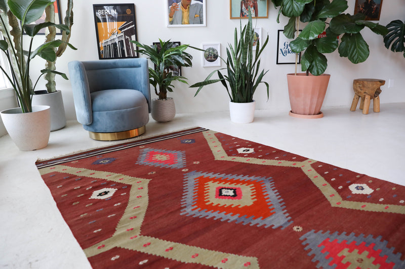 Vintage Turkish rug in a living room setting, pile rug, Turkish rug, vintage rug, portland, rug shop, bright colors, wild shaman, soft rug, bold color, Portland, Oregon, rug store, rug shop, local shop, antique rug