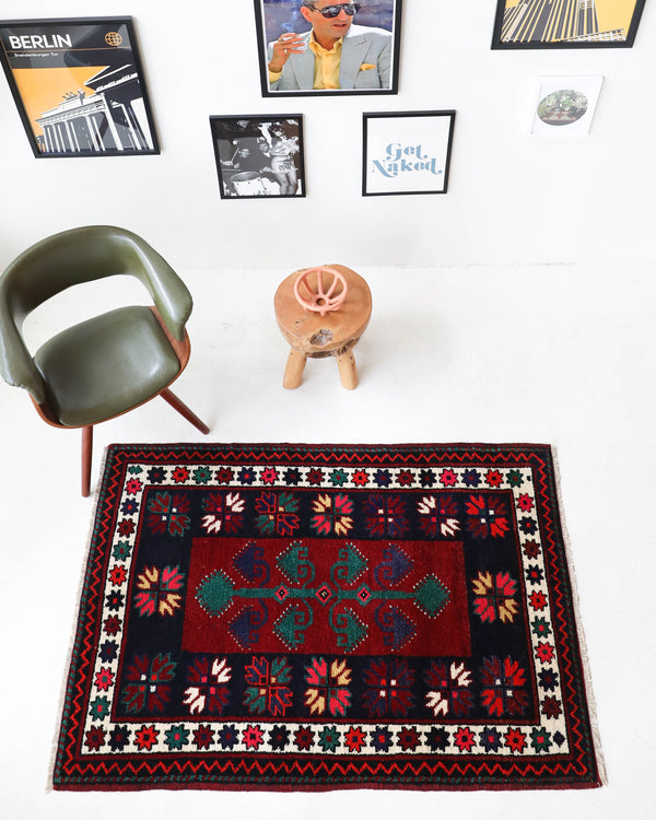 Vintage Turkish rug in a living room setting, pile rug, Turkish rug, vintage rug, portland, rug shop, bright colors, wild shaman, soft rug, bold color, Portland, Oregon, rug store, rug shop, local shop