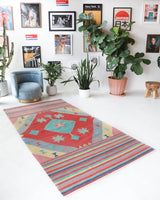 Vintage kilim rug in room decor setting, old rug, antique rug, pastel colors, faded colors, Turkish rug, vintage rug, soft rug, Portland, Oregon, rug store, rug shop, local shop, bold colors, bright colors, faded colors