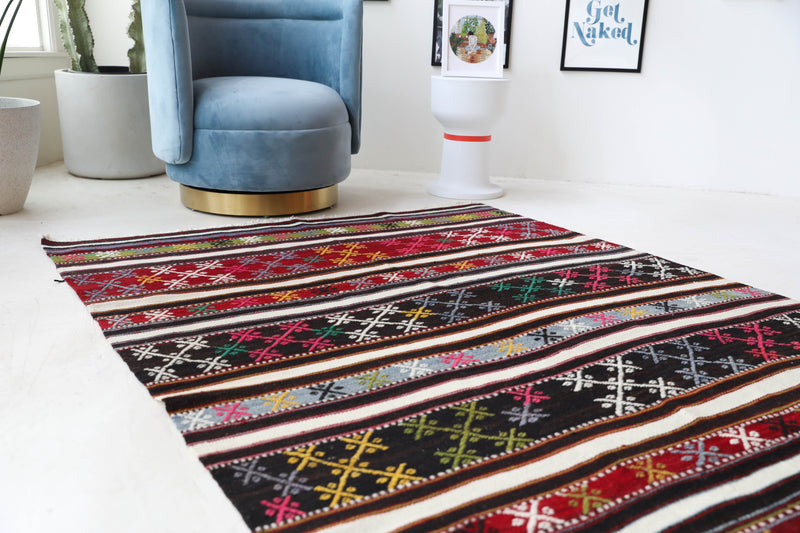 Vintage kilim rug in living room setting, bright colors, wild shaman, soft rug, bold color, Portland, Oregon, rug store, rug shop, local shop, vintage rug, modern kilim, warm colors