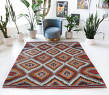 Vintage kilim rug in room decor setting, old rug, antique rug, pastel colors, faded colors, Turkish rug, vintage rug, soft rug, Portland, Oregon, rug store, rug shop, local shop, bold colors, bright colors, faded colors