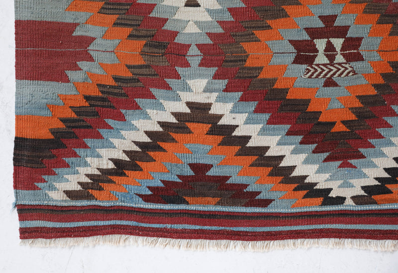 Vintage kilim rug in room decor setting, old rug, antique rug, pastel colors, faded colors, Turkish rug, vintage rug, soft rug, Portland, Oregon, rug store, rug shop, local shop, bold colors, bright colors, faded colors