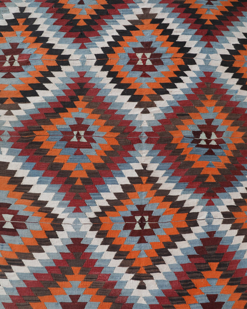 Vintage kilim rug in room decor setting, old rug, antique rug, pastel colors, faded colors, Turkish rug, vintage rug, soft rug, Portland, Oregon, rug store, rug shop, local shop, bold colors, bright colors, faded colors