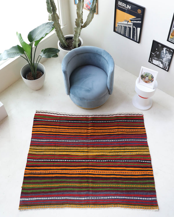 Vintage kilim rug in living room setting, bright colors, wild shaman, soft rug, bold color, Portland, Oregon, rug store, rug shop, local shop, vintage rug, modern kilim, warm colors