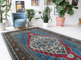 Vintage Turkish rug in a living room setting, Area rug in a living room setting, pile rug, Turkish rug, custom rug, modern rug, portland, rug shop, bright colors, wild shaman, soft rug, bold color, Portland, Oregon, rug store, rug shop, local shop