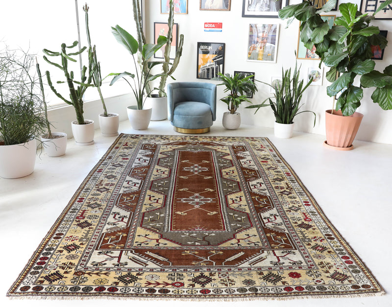 Vintage Turkish rug in living room setting, old rug, antique rug, pastel colors, faded colors, Turkish rug, vintage rug, soft rug, Portland, Oregon, rug store, rug shop, local shop