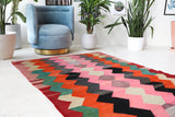 Vintage kilim rug in living room setting, bright colors, wild shaman, soft rug, bold color, Portland, Oregon, rug store, rug shop, local shop, vintage rug, modern kilim, warm colors