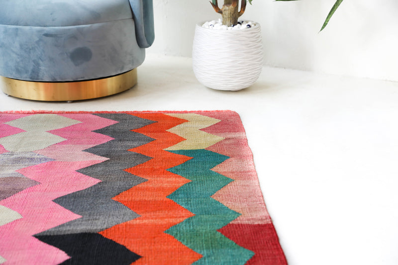 Vintage kilim rug in living room setting, bright colors, wild shaman, soft rug, bold color, Portland, Oregon, rug store, rug shop, local shop, vintage rug, modern kilim, warm colors