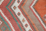 Vintage kilim rug in living room setting, old rug, antique rug, pastel colors, faded colors, Turkish rug, vintage rug, soft rug, Portland, Oregon, rug store, rug shop, local shop, earthy tones, earthy colors, warm colors