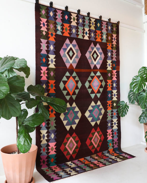 Vintage kilim rug in living room setting, bright colors, wild shaman, soft rug, bold color, Portland, Oregon, rug store, rug shop, local shop, vintage rug, modern kilim, warm colors