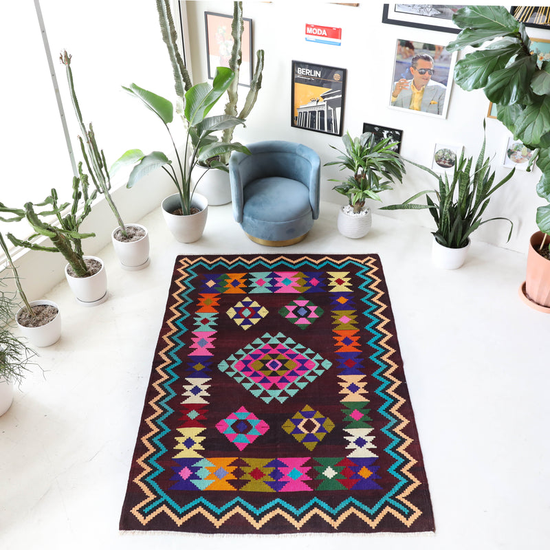 Vintage kilim rug in living room setting, bright colors, wild shaman, soft rug, bold color, Portland, Oregon, rug store, rug shop, local shop, vintage rug, modern kilim, warm colors